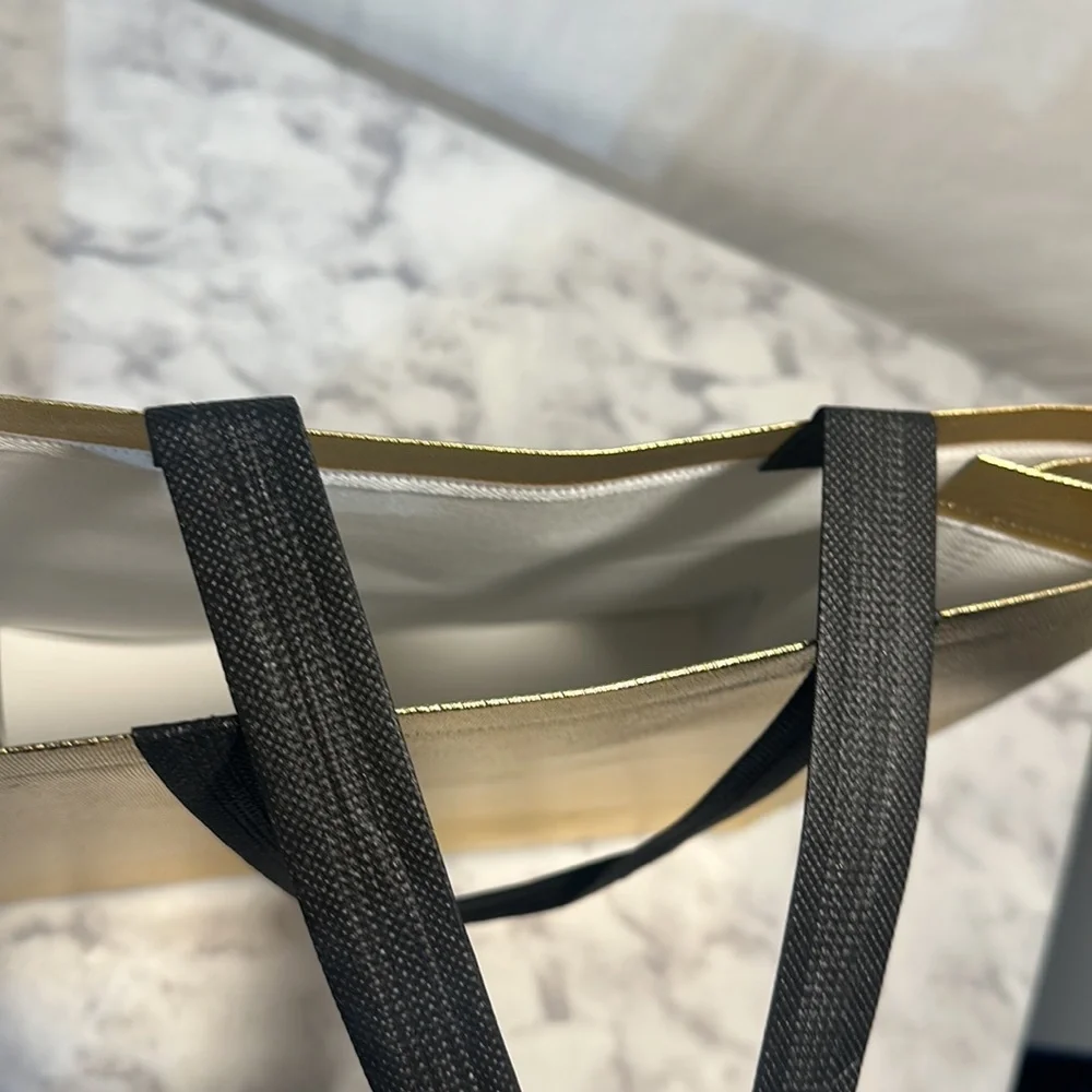 11 Sturdy Reusable Bags with handles in glossy gold.